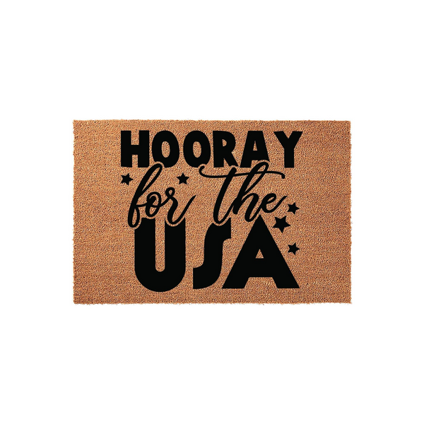 Hooray for the USA coir doormat featuring bold black text and decorative stars on a natural brown fiber background, creating a festive patriotic entrance decor piece for your front porch or home entryway during the summer