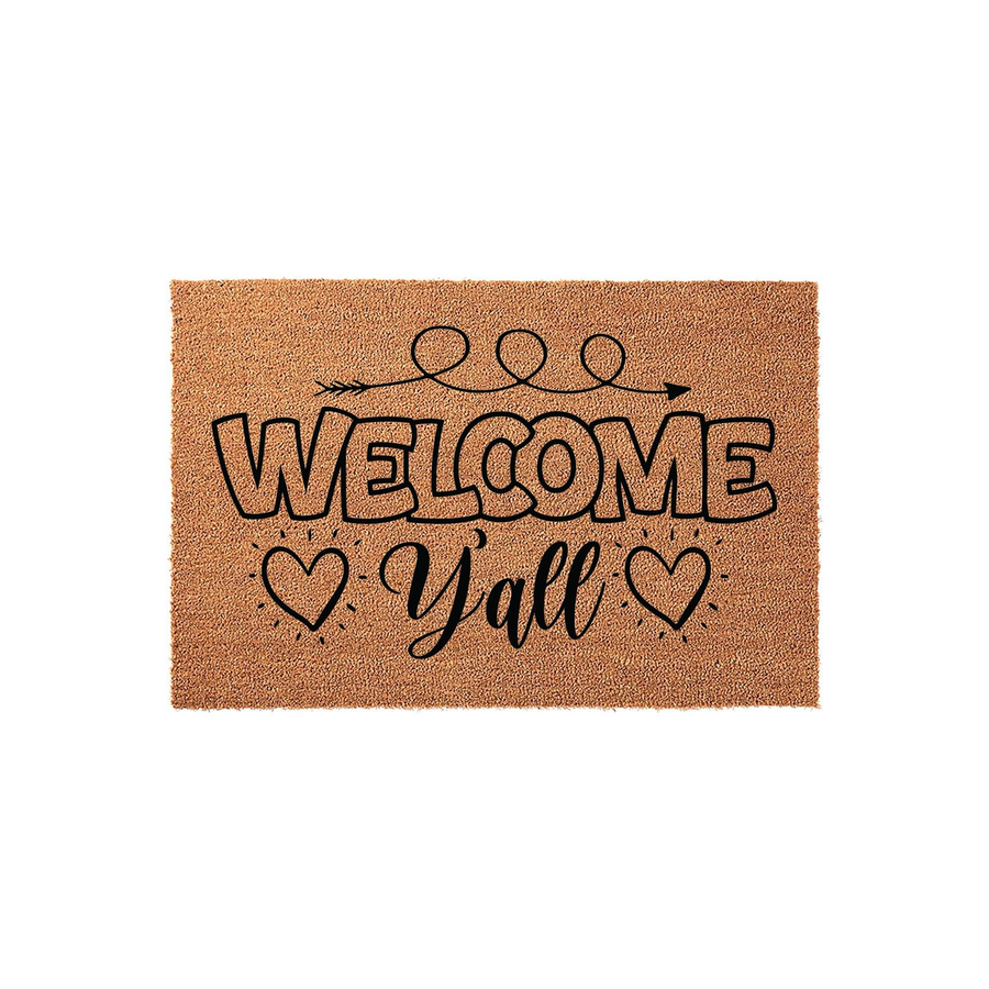 Welcome Yall Coir Doormat featuring a natural tan fiber texture with bold black text that reads Welcome Yall, accented by a decorative arrow graphic and two small hearts on a clean white background for a rustic farmhouse porch