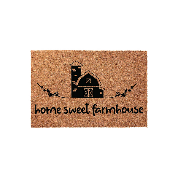 Home Sweet Farmhouse coir doormat featuring a black printed barn and silo illustration with decorative leafy branches, set against a natural brown coconut fiber background for a rustic country style entryway or front porch decor.