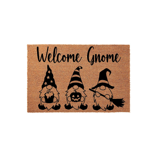 Halloween Welcome Gnome doormat featuring three cute gnomes in black ink on a natural coir background, with the text Welcome Gnome written in a script font above the gnomes holding a cauldron, a pumpkin, and a witch broom for