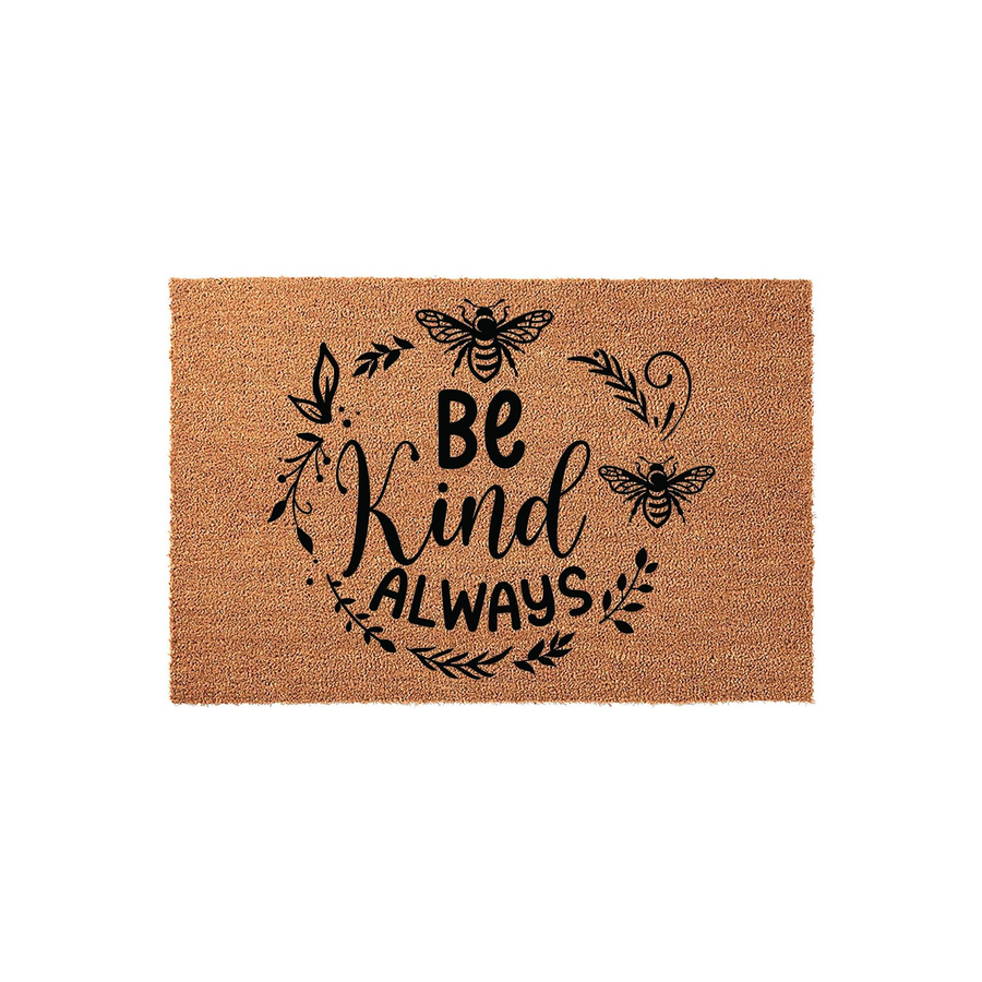 Be Kind Always coir doormat featuring a natural tan fiber texture with a black printed design of buzzing bees and leafy floral accents, creating a welcoming and cheerful entryway decor piece for your front porch or home entrance.