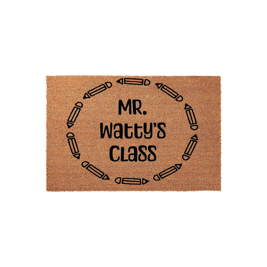 Personalized Teacher Classroom Doormat featuring a natural coir texture with a circular border of black pencil icons surrounding custom text that reads as a teacher's class name, perfect for a school entrance or classroom door
