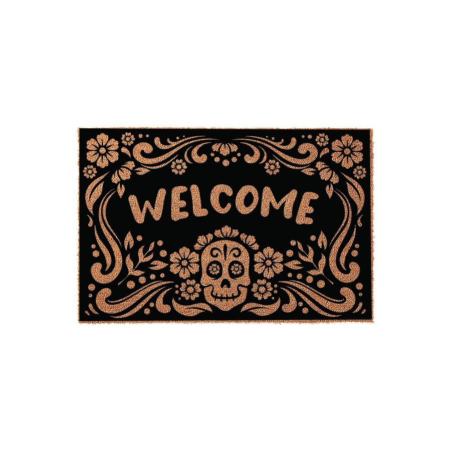 Sugar Skull Welcome Doormat featuring a black background with a copper-colored floral design and a central skull motif, creating a festive Day of the Dead aesthetic for your front porch entry decor on a plain white studio