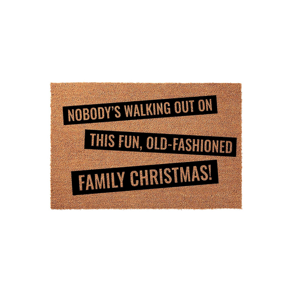 Funny Christmas doormat featuring the quote Nobody's Walking Out On This Fun, Old-Fashioned Family Christmas printed in bold black text on a natural tan coir fiber background, perfect for holiday home decor and festive entryway