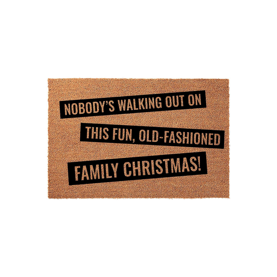 Funny Christmas doormat featuring the quote Nobody's Walking Out On This Fun, Old-Fashioned Family Christmas printed in bold black text on a natural tan coir fiber background, perfect for holiday home decor and festive entryway