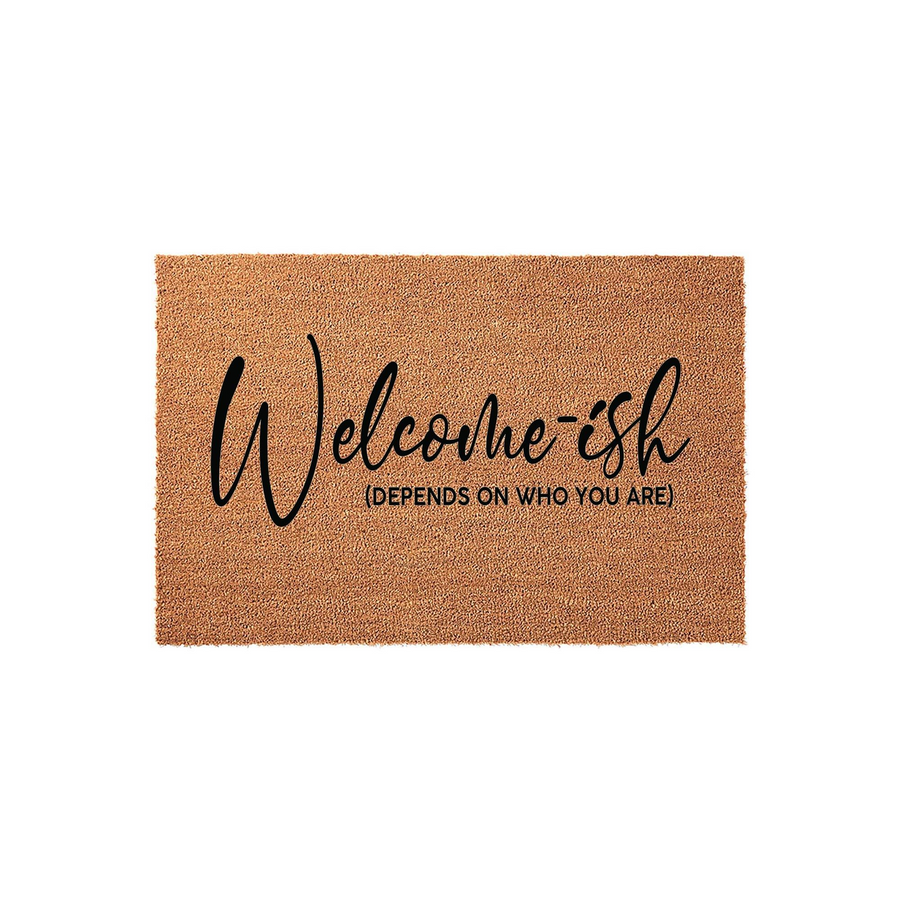 Welcome-ish Depends On Who You Are funny doormat made of natural coir fiber with a rectangular shape, featuring bold black script and sans-serif text centered on the textured brown surface for a humorous front porch entryway