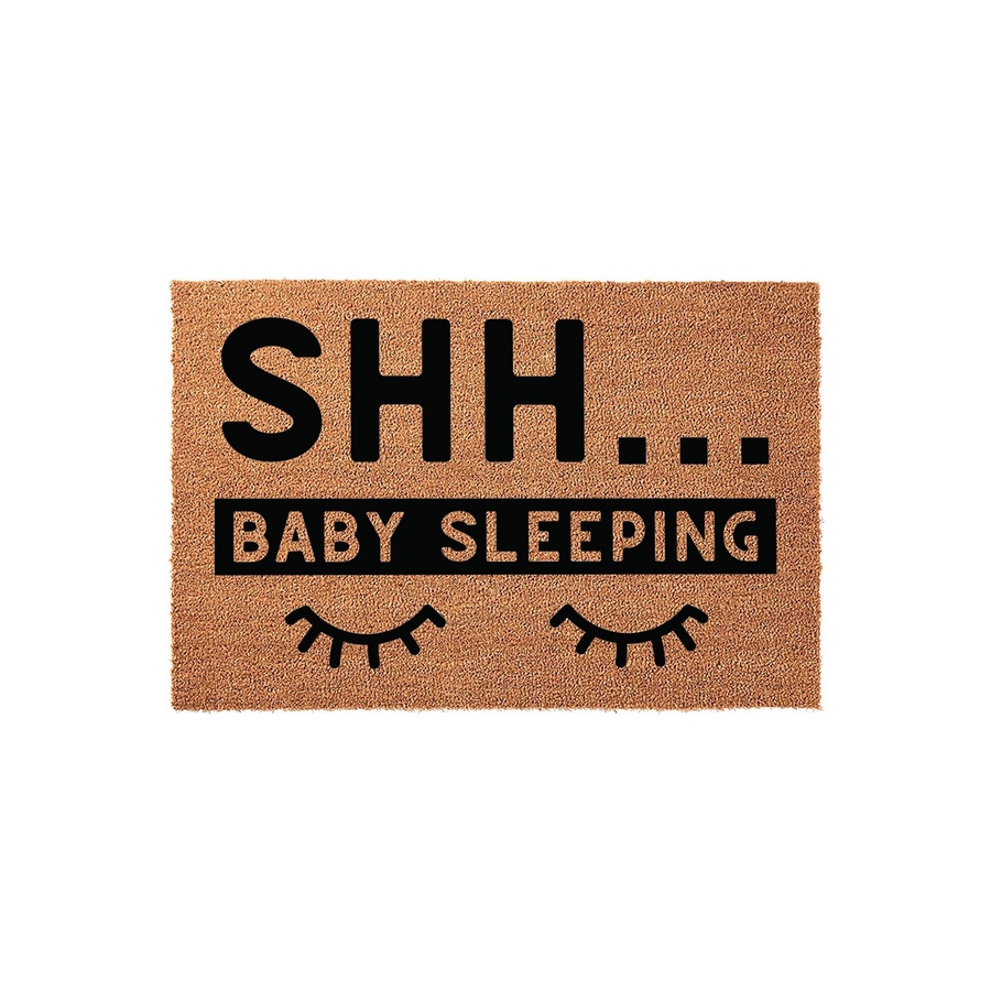 Shh Baby Sleeping doormat featuring a natural coir texture with bold black text and closed eye icons, designed to alert visitors to keep quiet while a newborn is resting inside the home on this durable front porch welcome mat.