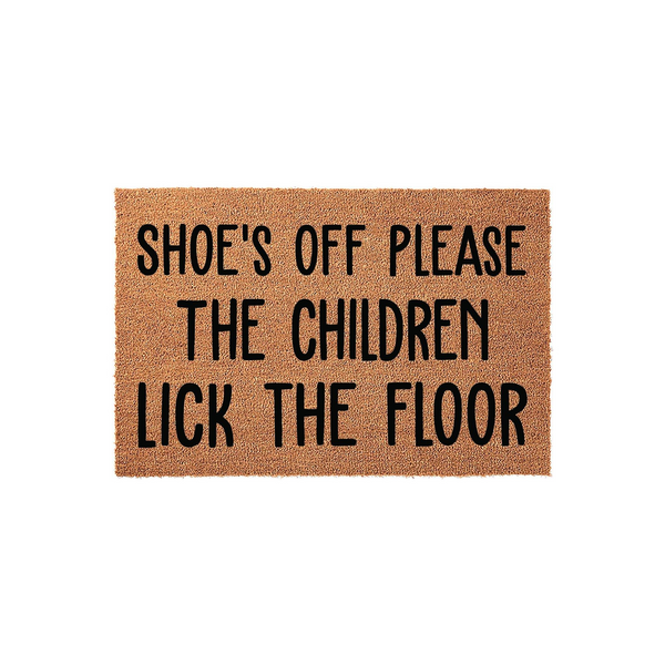 Funny Shoe's Off Please The Children Lick The Floor coir doormat featuring bold black text on a natural brown fiber background, designed as a humorous entryway rug for a home with kids to keep the floors clean and guests