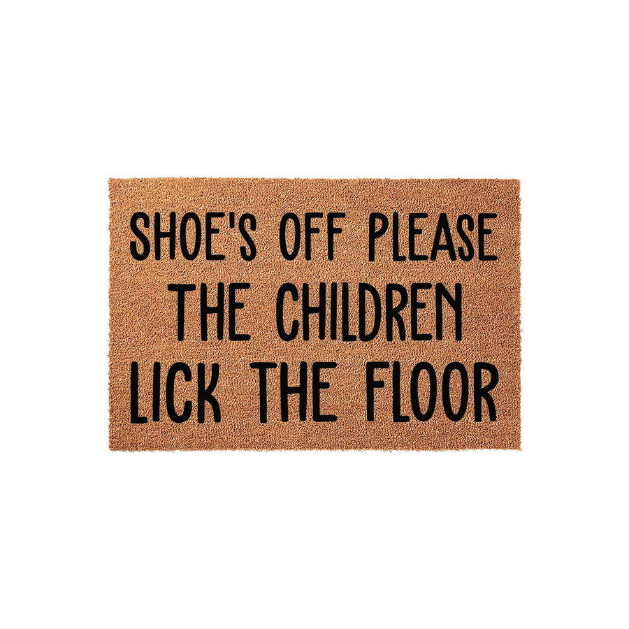 Funny Shoe's Off Please The Children Lick The Floor coir doormat featuring bold black text on a natural brown fiber background, designed as a humorous entryway rug for a home with kids to keep the floors clean and guests