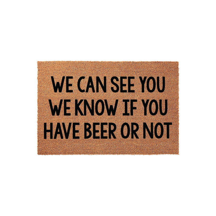 Funny Beer Welcome Doormat featuring a natural coir texture with bold black text that reads We Can See You We Know If You Have Beer Or Not, making it a humorous and functional outdoor floor mat for any home entrance or porch area.