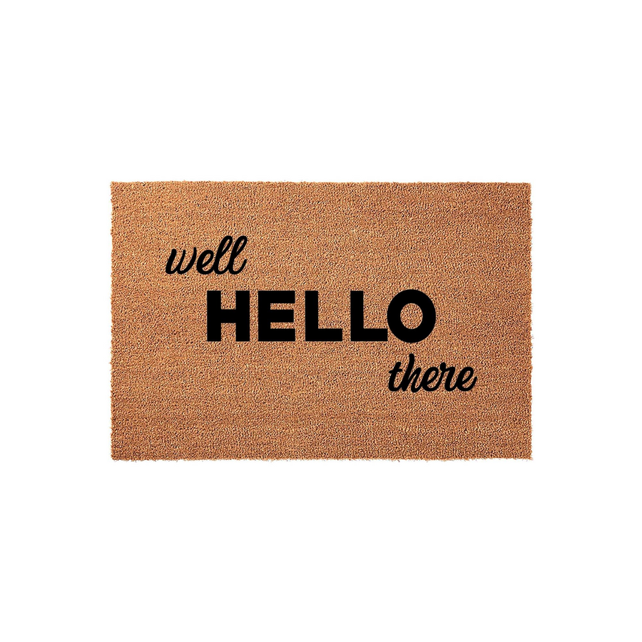 Well Hello There coir doormat featuring a natural brown fiber texture and bold black typography, providing a welcoming and modern entrance decor piece for your front porch or home entryway on a clean white background.