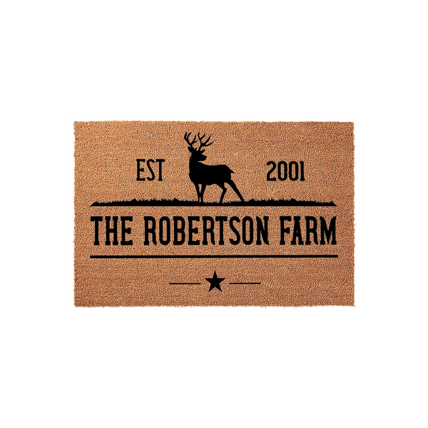 Personalized Farmhouse Doormat featuring a rustic deer silhouette and custom family name text on a natural coir fiber background, creating a welcoming entrance for any home or ranch with its classic established date design.