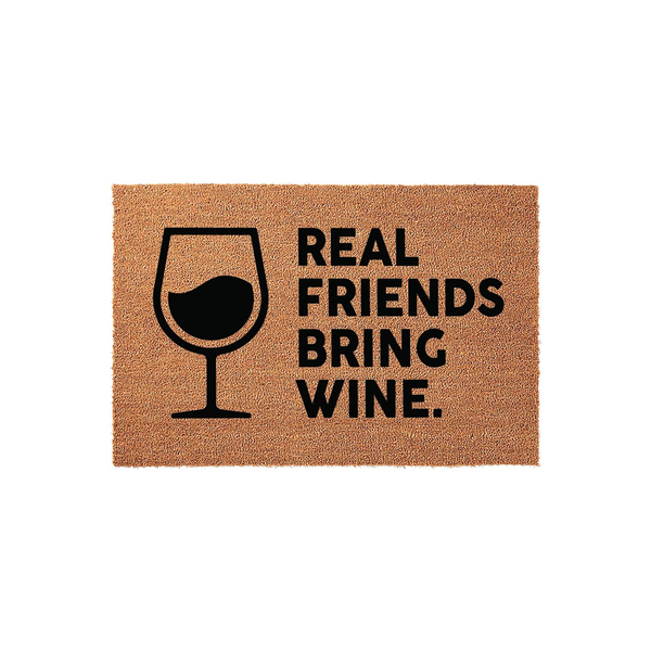 Real Friends Bring Wine coir doormat featuring a black graphic of a wine glass on the left side and bold text on the right, set against a natural tan textured fiber background for a fun and welcoming front porch entryway decor