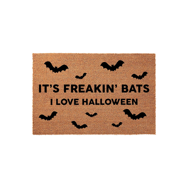It's Freakin' Bats I Love Halloween doormat featuring a natural coir fiber texture with black printed text and scattered bat silhouettes, creating a festive and spooky entryway decor piece for the autumn holiday season.