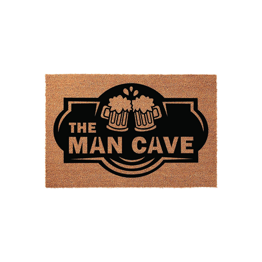 The Man Cave coir doormat features a bold black graphic of two clinking beer mugs above the text, set against a natural brown coconut fiber background that provides a durable and rustic look for any home entrance or basement game