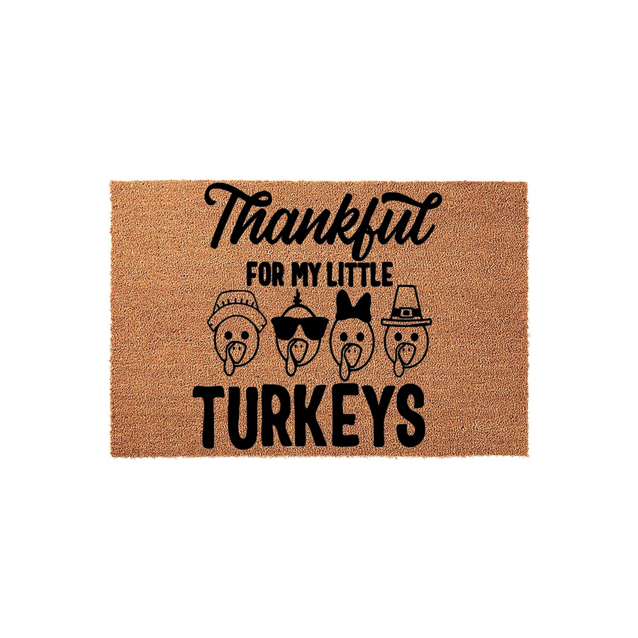 Thankful For My Little Turkeys coir doormat featuring four cute turkey illustrations wearing hats and sunglasses, set against a natural brown fiber background for a festive and welcoming Thanksgiving home decor entrance.