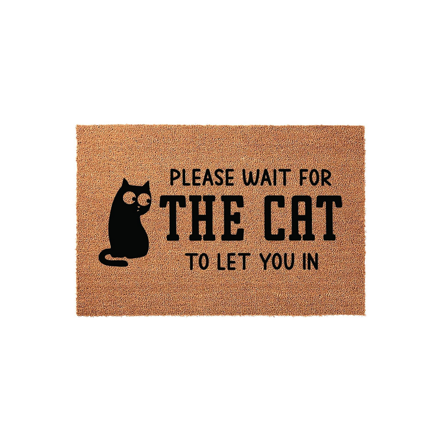 Funny Cat Welcome Doormat made of natural coir fiber, featuring a black silhouette of a wide-eyed cat and the text Please Wait For The Cat To Let You In, set against a plain white background for a clean and humorous entryway