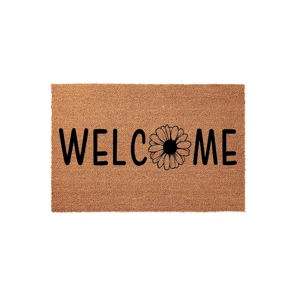 Floral Welcome Coir Doormat featuring a natural tan fiber texture with bold black lettering and a daisy flower replacing the letter O, creating a charming and rustic entryway accent for your front porch or home entrance decor.