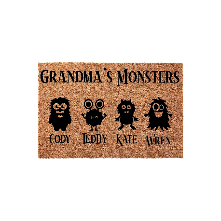 Personalized Grandma Monsters doormat made of natural coir fiber, featuring a playful design with four unique black monster illustrations and space for custom names printed in a bold, dark font against the textured tan background.