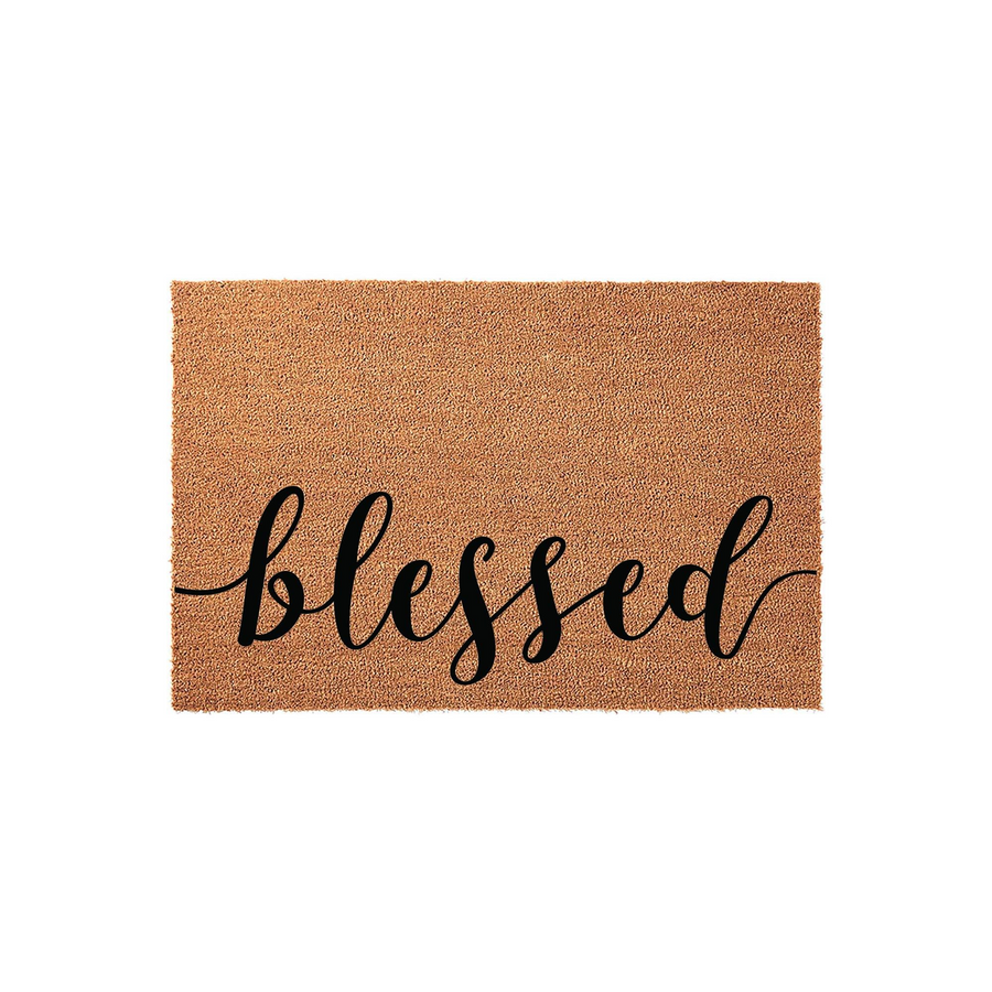 Blessed coir doormat featuring a natural tan fiber texture and elegant black cursive script lettering centered on the front, providing a welcoming and rustic farmhouse aesthetic for your front porch or entryway decor.