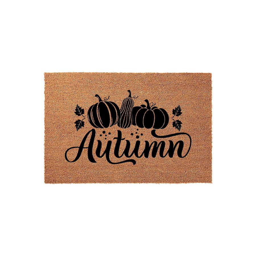 Autumn pumpkin coir doormat featuring a natural tan fiber texture with a black printed design of three pumpkins, gourds, and fall leaves, centered with the word Autumn written in a decorative script font for seasonal porch decor.