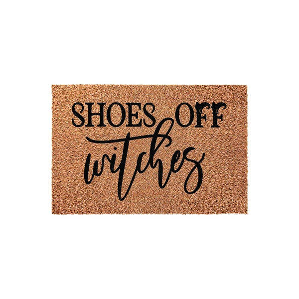 Funny Shoes Off Witches coir doormat featuring bold black typography on a natural brown textured fiber background, perfect for a spooky Halloween entryway or a humorous home decor statement for any front porch or apartment door