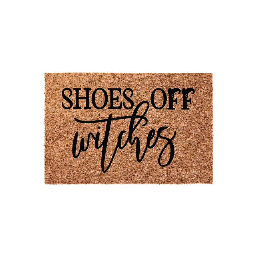 Funny Shoes Off Witches coir doormat featuring bold black typography on a natural brown textured fiber background, perfect for a spooky Halloween entryway or a humorous home decor statement for any front porch or apartment door