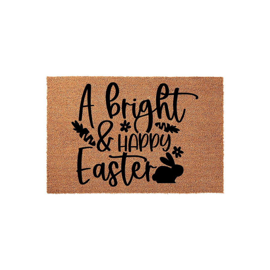 A Bright and Happy Easter coir doormat features a natural tan fiber texture with bold black lettering, decorative floral accents, and a cute bunny silhouette to welcome guests to your home during the spring holiday season.
