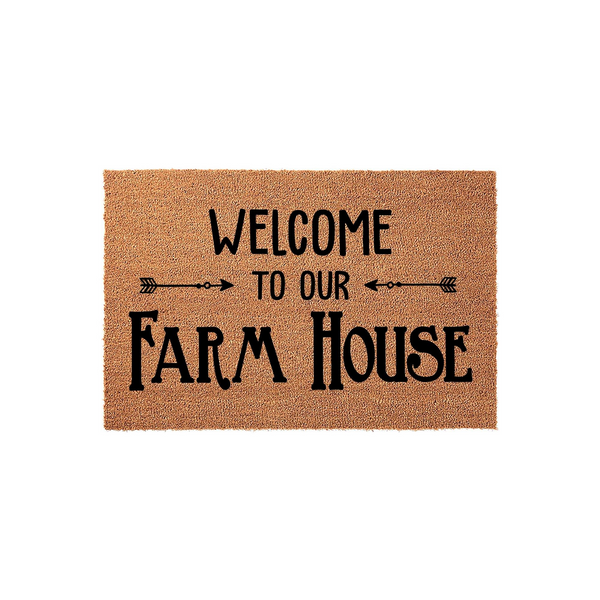 Farmhouse Welcome Doormat featuring a natural coir texture with black printed text that reads Welcome To Our Farm House, accented by decorative arrow graphics on a clean white background for a rustic entryway decor style.