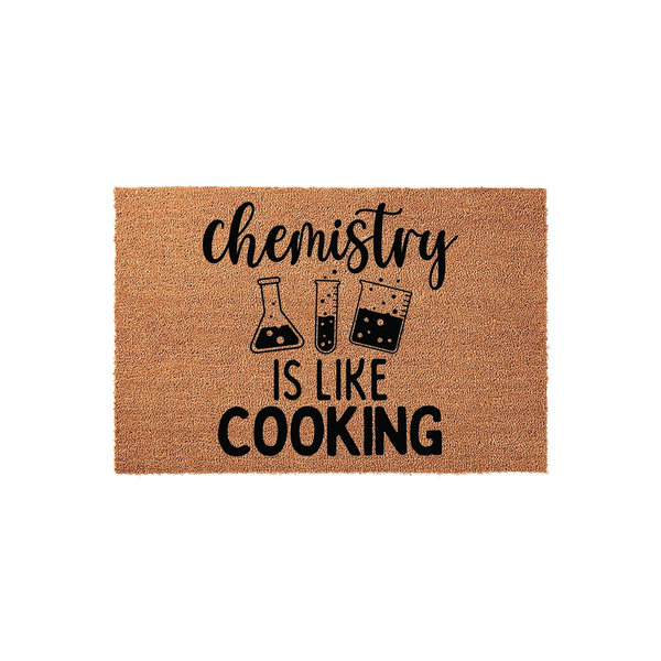 Chemistry Is Like Cooking doormat made of natural coir fiber, featuring a humorous science-themed design with black text and laboratory glassware illustrations printed on a textured, rectangular brown background for a fun home