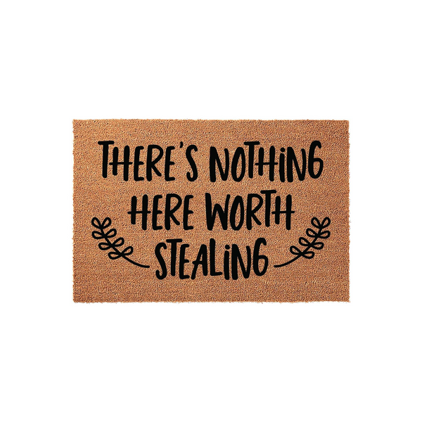 Funny There Is Nothing Here Worth Stealing doormat featuring bold black typography on a natural tan coir fiber background, accented with decorative leaf flourishes on either side of the text for a humorous front porch welcome.