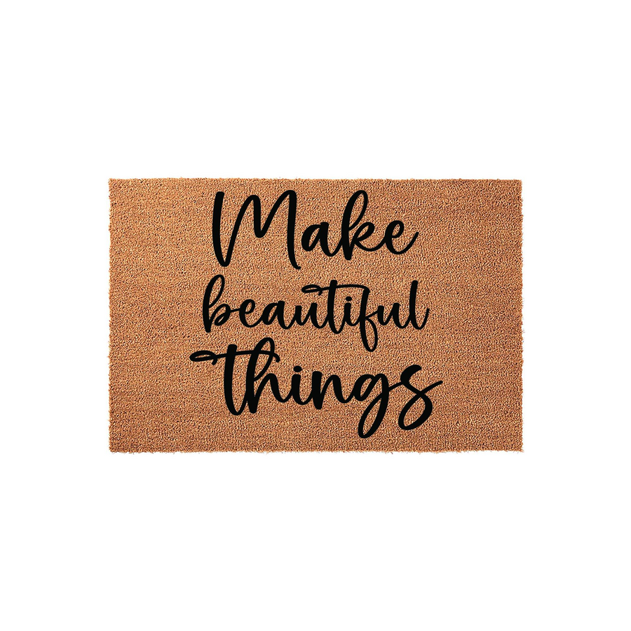 Make Beautiful Things coir doormat featuring a natural tan fiber texture and bold black script lettering, providing a welcoming and inspirational touch to your front porch entryway decor with its durable and rustic outdoor design.