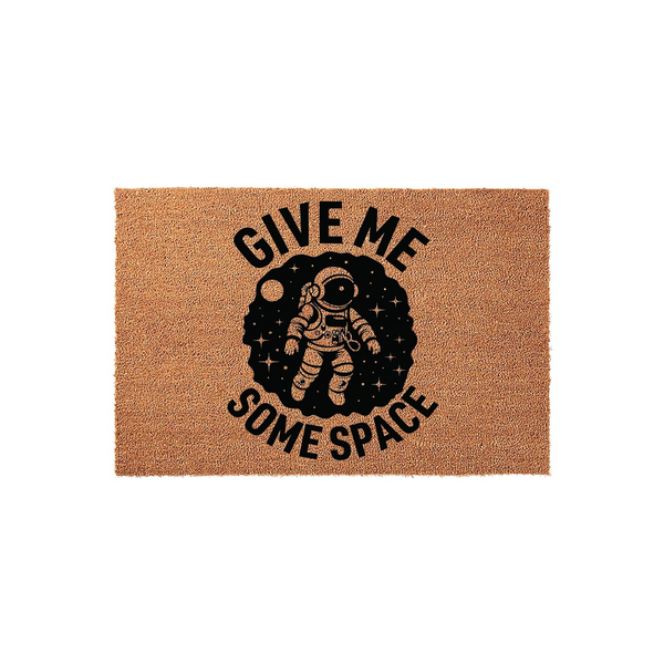 Astronaut Give Me Some Space doormat featuring a natural coir texture with a black printed graphic of an astronaut floating in a starry galaxy, creating a fun and whimsical welcome mat for any space enthusiast or science lover