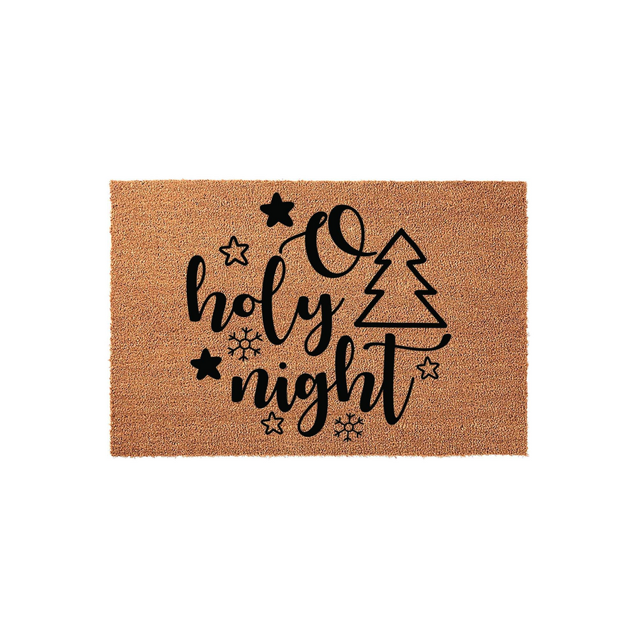 O Holy Night Christmas doormat made of natural coir fiber, featuring black script lettering, a stylized pine tree, and various star and snowflake icons printed on a rectangular mat against a clean, solid white studio background.