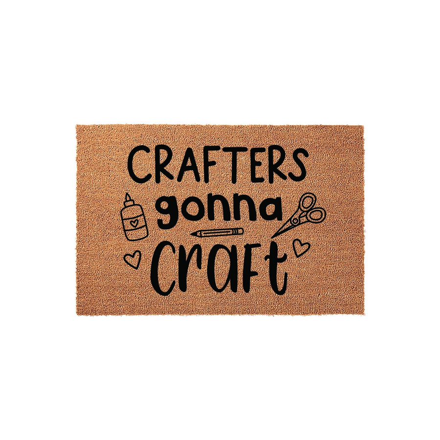 Crafters Gonna Craft coir doormat featuring a natural tan fiber texture with black printed text and cute illustrations of glue, scissors, and a pencil, making it a fun entryway rug for any dedicated hobbyist or creative craft