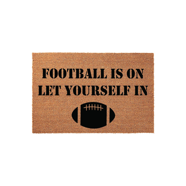 Football Is On Let Yourself In coir doormat featuring a natural brown fiber texture and bold black stencil lettering with a football graphic, creating a fun sports-themed entryway decor piece for any fan's home front porch.