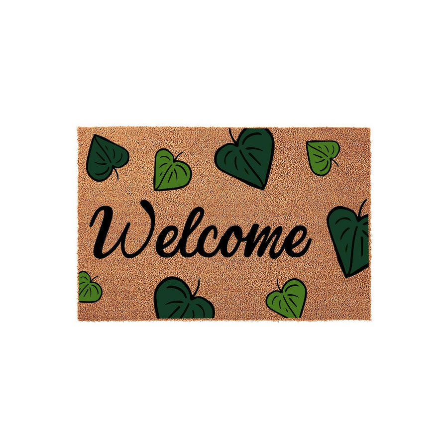 Botanical Welcome Doormat featuring a natural coir texture decorated with hand-drawn green heart-shaped leaves scattered across the surface, providing a charming and inviting entryway accent for your front porch or home decor.