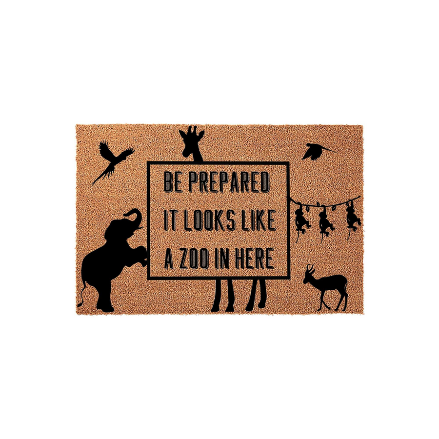 Zoo Animal Welcome Doormat featuring a natural coir texture with black silhouettes of an elephant, giraffe, monkeys, and birds surrounding the humorous text that reads Be Prepared It Looks Like A Zoo In Here for a fun home