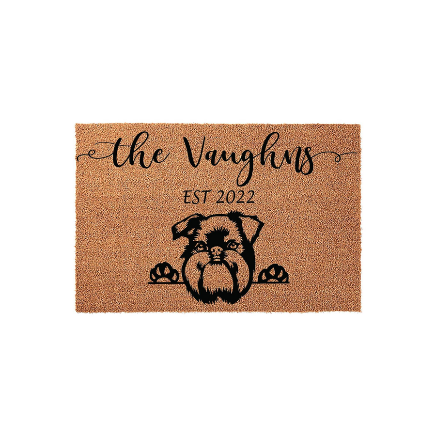 Personalized Brussels Griffon doormat featuring a cute dog illustration peeking over the edge, customized with a family name and established year on a natural coir fiber background for a welcoming front porch entrance decor.