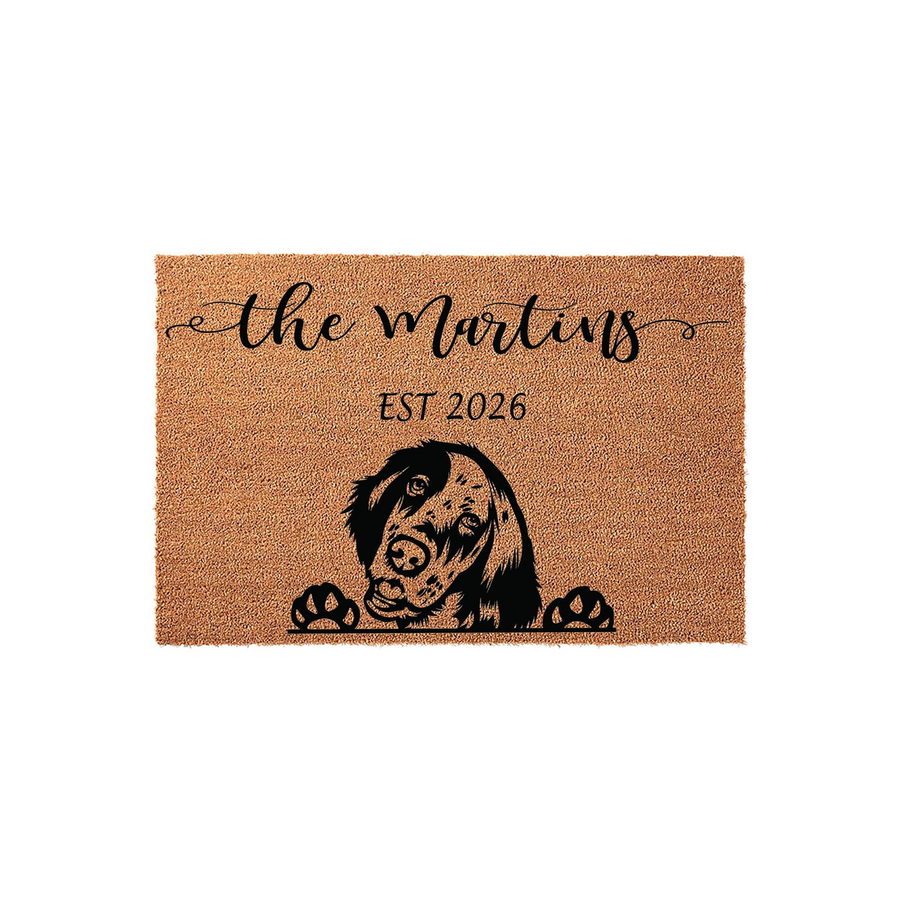 Personalized English Setter doormat featuring a cute dog illustration peeking over the bottom edge, customized with a family name and established year on a natural coir fiber background for a welcoming front porch entrance.