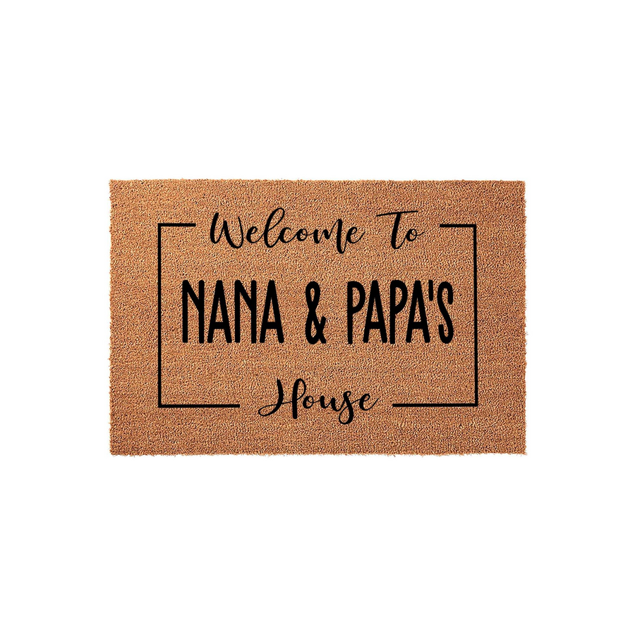 Personalized Nana and Papa's House doormat featuring a natural coir texture with black printed text inside a simple rectangular border, creating a welcoming entryway accent for a grandparent's home on a clean white studio