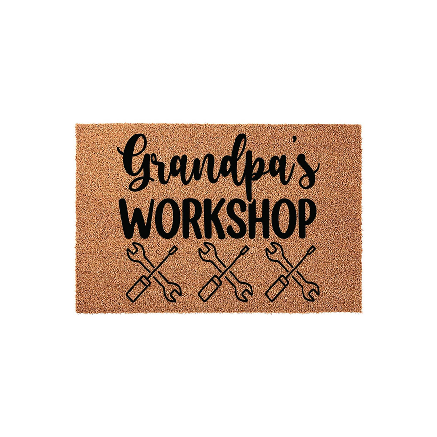 Grandpa's Workshop coir doormat featuring a natural brown fiber texture with black printed text and a row of three crossed wrench icons, creating a fun and functional entryway decor piece for a garage or home workshop space.