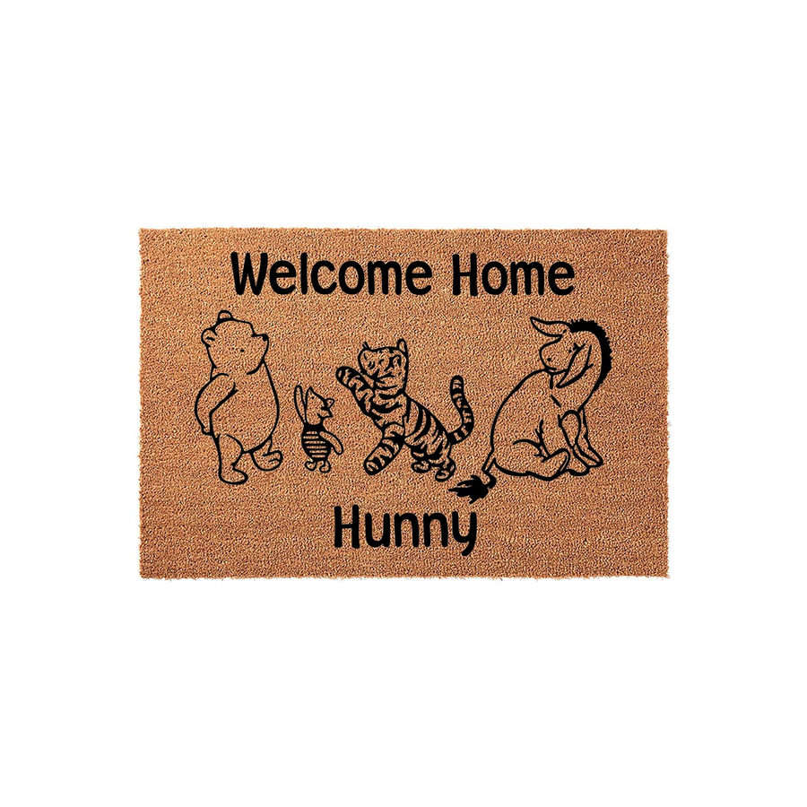 Winnie the Pooh Welcome Home Hunny coir doormat featuring a black line art illustration of Pooh, Piglet, Tigger, and Eeyore on a natural brown fiber background, creating a charming entryway rug for any fan of the classic