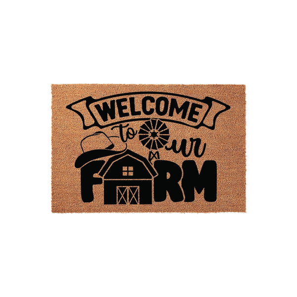 Farmhouse Welcome To Our Farm doormat featuring a rustic barn, windmill, and cowboy hat graphic printed in black on a natural coir fiber mat, creating a charming entryway accent for any country home or farmhouse style front porch