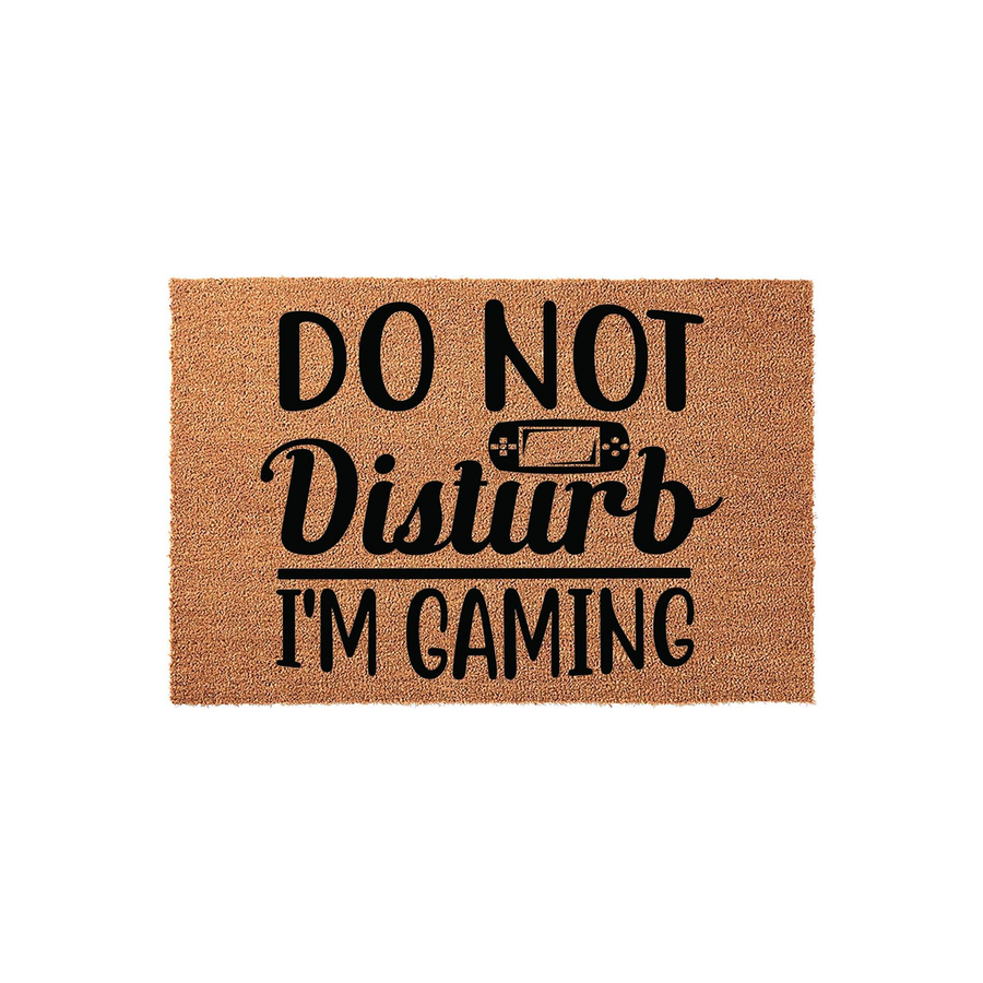 Do Not Disturb I'm Gaming coir doormat featuring a natural brown fiber texture and bold black text with a small handheld video game console icon, perfect for a gamer's bedroom door or a fun entryway welcome mat for any video game