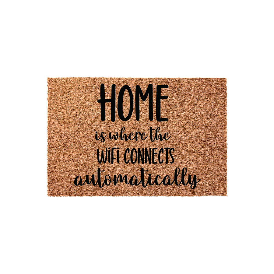Funny Home Is Where The Wifi Connects Automatically Doormat made of natural coir fibers, featuring bold black typography printed on a textured brown surface that adds a humorous and welcoming touch to any front porch or entryway