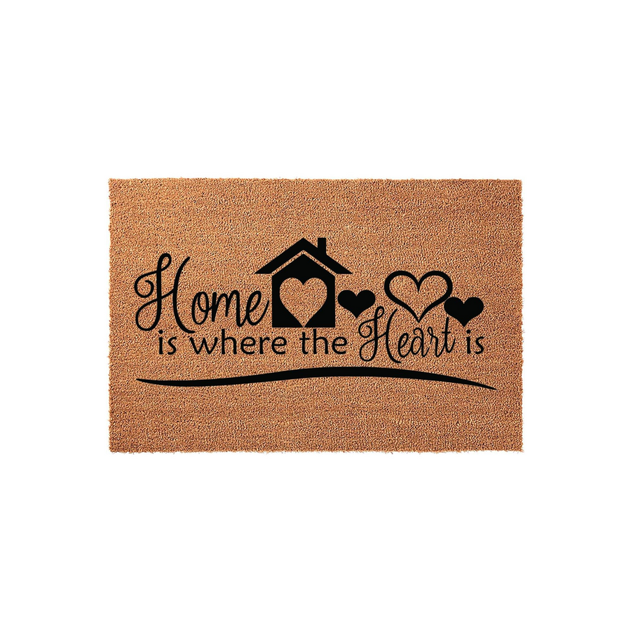 Home is Where the Heart Is coir doormat featuring a natural tan fiber texture with black printed text and a house icon with heart accents, creating a welcoming entryway decor piece for a housewarming or a new home celebration.