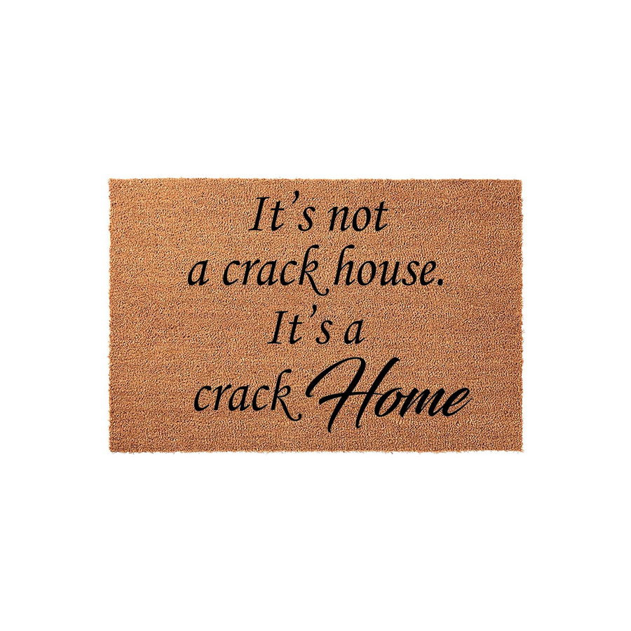 Funny doormat with a natural coir texture featuring the humorous black text that reads It is not a crack house, it is a crack home, making this a witty and sarcastic entryway rug for a modern home with a bold sense of humor.