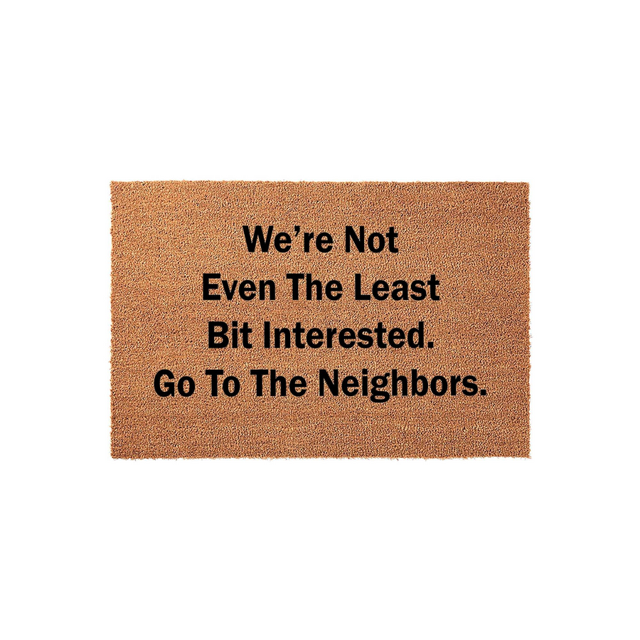 Funny Coir Doormat with the text We are not even the least bit interested, go to the neighbors printed in bold black letters on a natural brown coconut fiber mat, perfect for a humorous front porch entrance or a sarcastic home