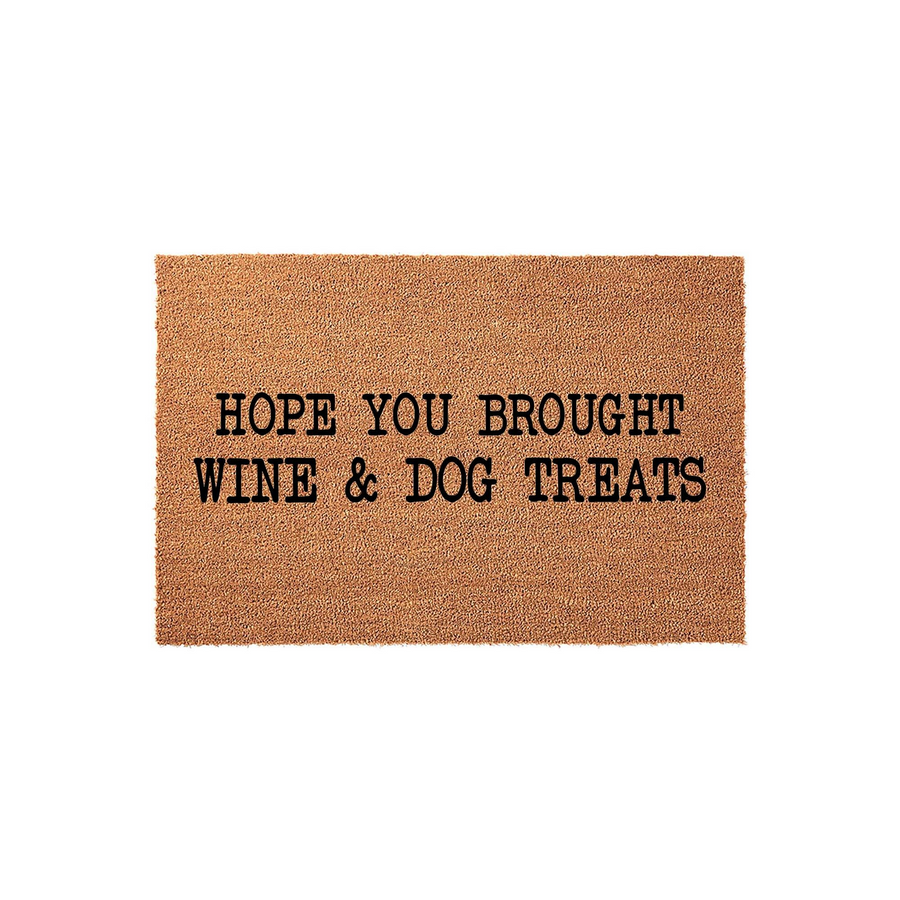 Funny Hope You Brought Wine and Dog Treats doormat made of natural coir fibers, featuring bold black text centered on a rectangular brown mat that adds a humorous and welcoming touch to any front porch or entryway decor.